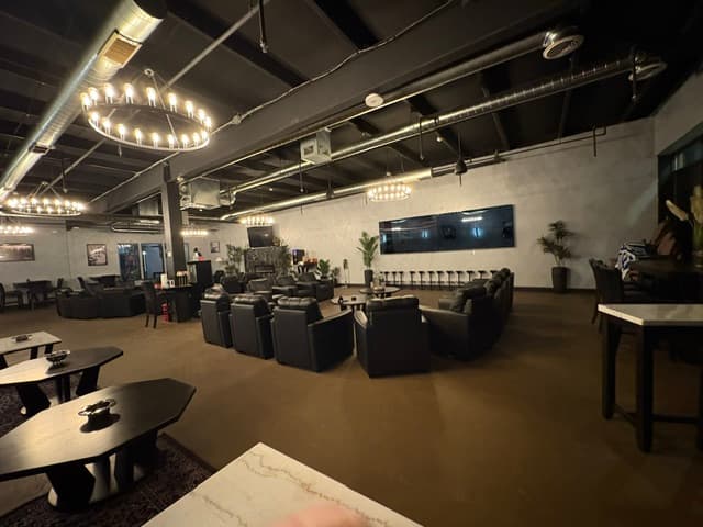 Panoramic view of lounge from front right with chandelier