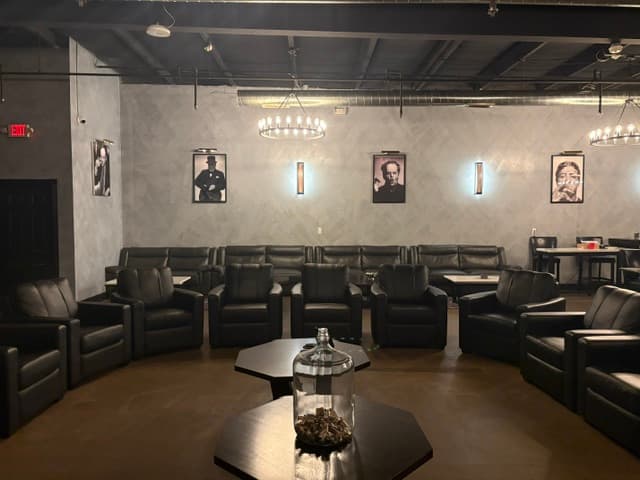 Seating area with artwork and ambient wall lighting